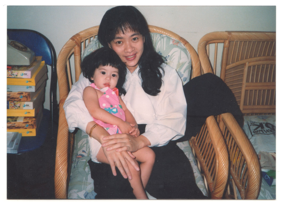 Wimon and Billie at our home in Bangkok, circa 1991. Note the rotary dial phone and the humongous stack of phone books. Making any sort of phone call in Bangkok at that time was a masochistic exercise.