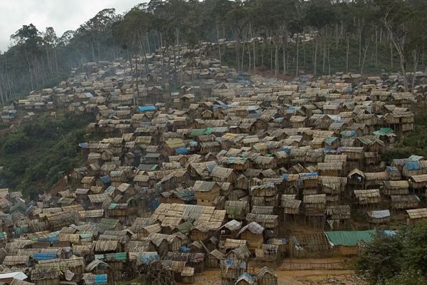 Like a long brown snake, the mining village of Moramanga creeps into the forest