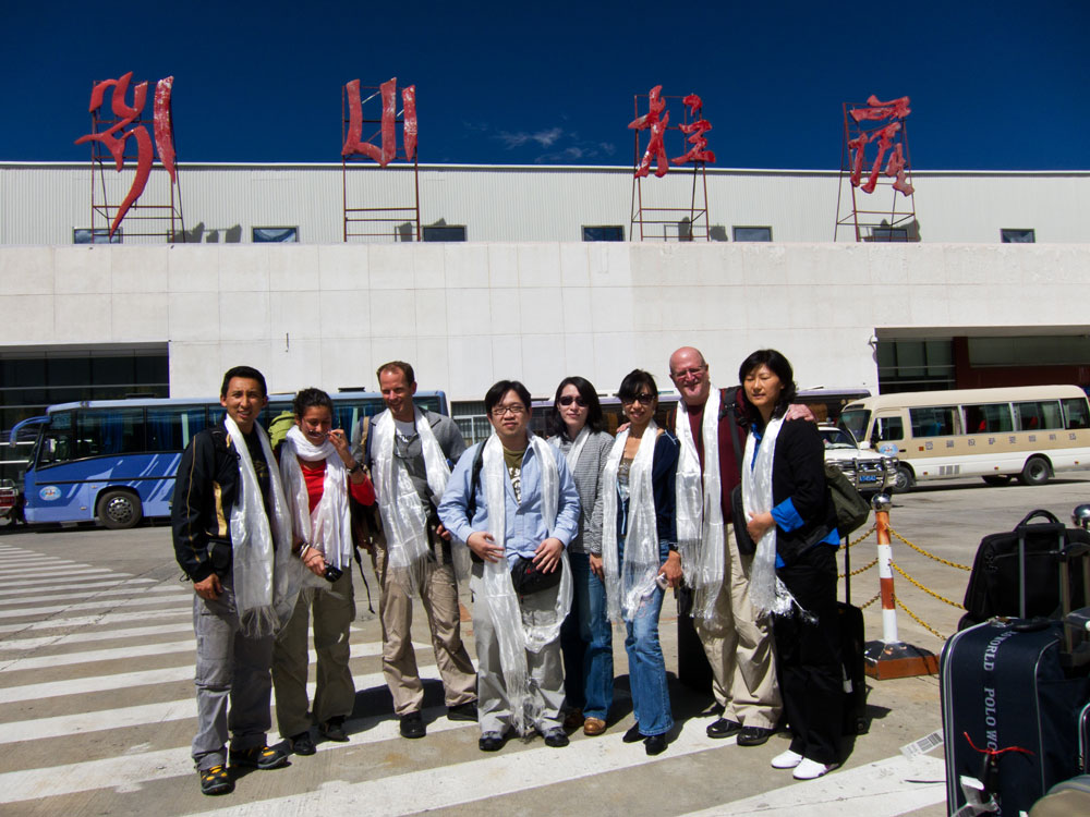 Figure 2. Team Tibet 2010 on arrival at Lhasa airport.&nbsp;From left to right: Ahmadjan Abduriyim, Flavie Isatelle, Brendan Laurs, Thanong Leelawatanasuk, Young Sze Man, Christina Iu, Richard Hughes and Lou Li Ping.