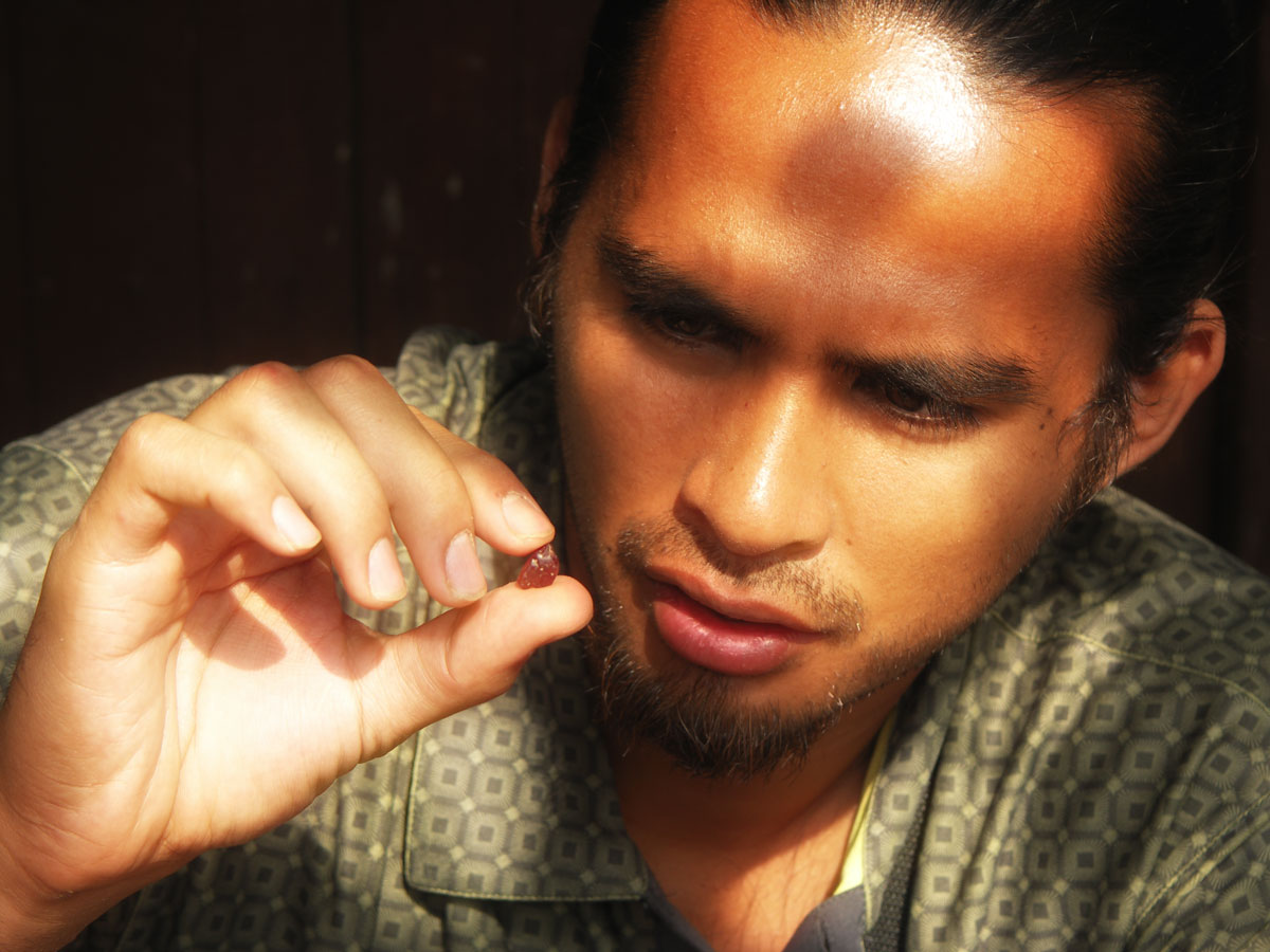 Michael Rogers examines a ruby at Ngemba Ngembambili, Songea.