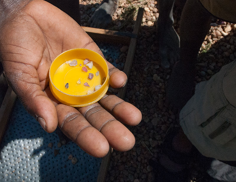 Handful of gem rough near Ilakaka, Madagascar. A family worked several days for these meager finds, illustrating just how rare fine gems are.