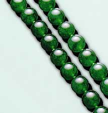 Figure B-2. Jadeite jade typically contains at least 90% jadeitic pyroxene in a rock that is typically more granular than nephrite. Note the vitreous surface luster of these translucent jadeite beads, which range from 9 to 10.5 mm in diameter. Photo courtesy of and © Christie's Hong Kong and Tino Hammid.