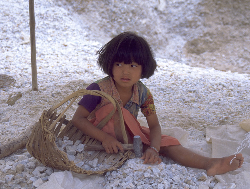 A young girl breaks marble in search of rubies at Kyauk Saung, in the Mogok Stone Tract. She told the author it was her summer holiday, and that she would be back in school in a few days.