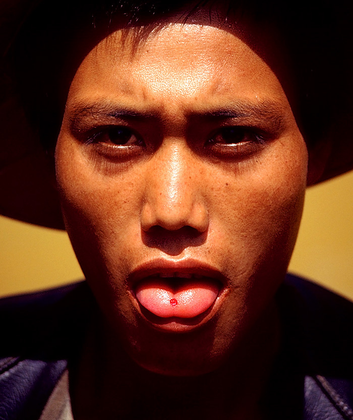 Important goods are kept close at hand. In the photo above, a miner at Mogok's Padan Sho mine shows off his latest find of pigeon's blood ruby