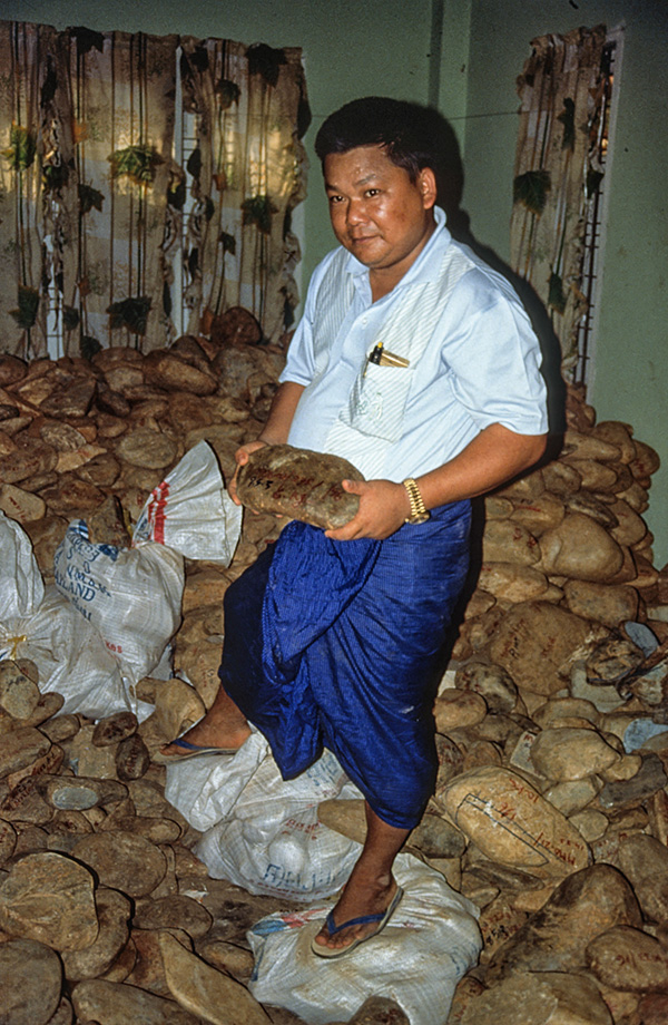 A room with a view U Tin Ngwe, who went from taxi driver to jade kingpin almost overnight, stands atop a small fortune of jade at his Hpakan home